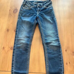 Silver brand blue jeans, distressed no holes, medium wash, skinny pencil cut